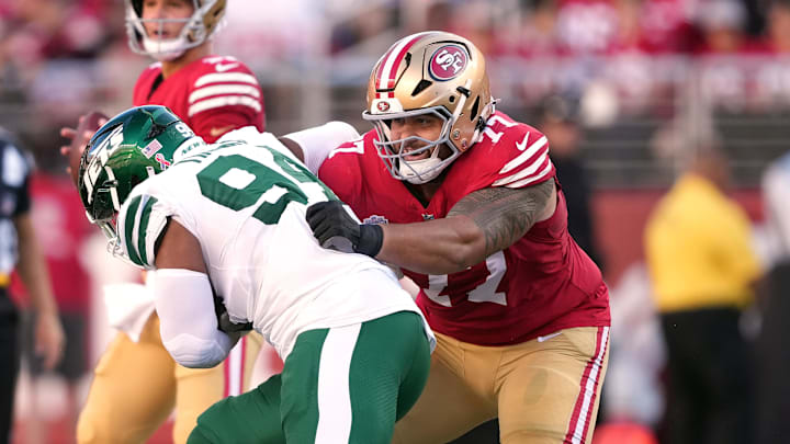 Sep 9, 2024; Santa Clara, California, USA; San Francisco 49ers guard Dominick Puni (77) blocks New York Jets defensive end Solomon Thomas (left) during the first quarter at Levi's Stadium. Mandatory Credit: Darren Yamashita-Imagn Images Sep 9, 2024; Santa Clara, California, USA; San Francisco 49ers guard Dominick Puni (77) blocks New York Jets defensive end Solomon Thomas (left) during the first quarter at Levi's Stadium. Mandatory Credit: Darren Yamashita-Imagn Images