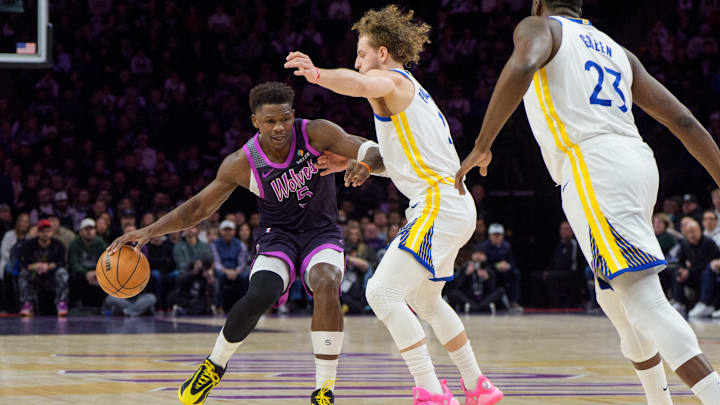 Jan 25, 2026; Minneapolis, Minnesota, USA; Minnesota Timberwolves guard Anthony Edwards (5) is guarded by Golden State Warriors guard Brandin Podziemski (2) and forward Draymond Green (23) in the first quarter at Target Center. Mandatory Credit: Matt Blewett-Imagn Images