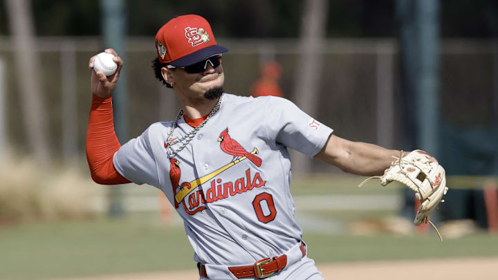 St. Louis Cardinals shortstop Masyn Winn (0) throws during spring training workouts at Roger Dean Stadium. 