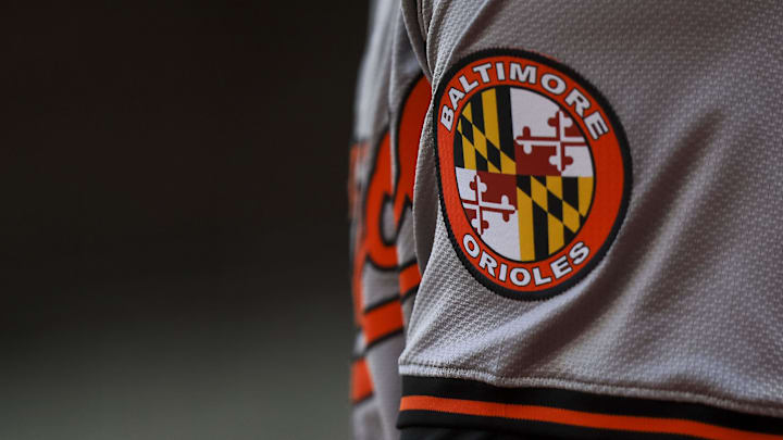 May 5, 2024; Cincinnati, Ohio, USA; The Baltimore Orioles logo on the sleeve of designated hitter Gunnar Henderson (2) as he prepares on deck during the seventh inning against the Cincinnati Reds at Great American Ball Park. Mandatory Credit: Katie Stratman-Imagn Images