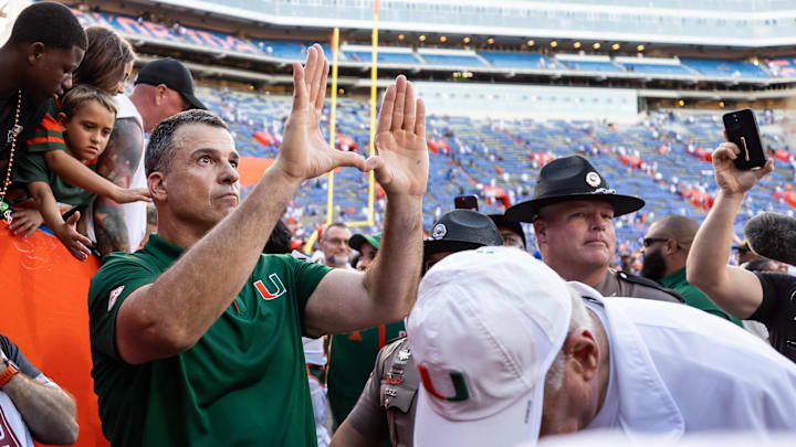 Aug 31, 2024; Gainesville, Florida, USA; Miami Hurricanes head coach Mario Cristobal gestures after a game against the Florida Gators at Ben Hill Griffin Stadium. Mandatory Credit: Matt Pendleton-Imagn Images