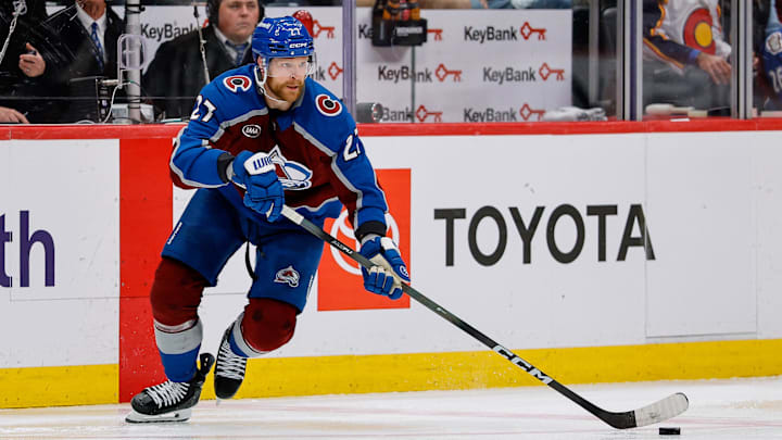 May 13, 2026; Denver, Colorado, USA; Colorado Avalanche defenseman Brett Kulak (27) controls the puck in overtime against the Minnesota Wild in game five of the second round of the 2026 Stanely Cup Playoffs at Ball Arena. Mandatory Credit: Isaiah J. Downing-Imagn Images