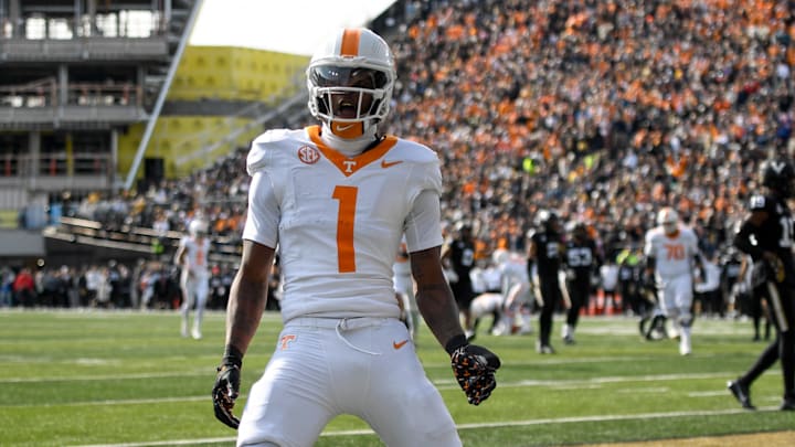 Nov 30, 2024; Nashville, Tennessee, USA;  Tennessee Volunteers wide receiver Dont'e Thornton Jr. (1) celebrates his touchdown with his teammates against the Vanderbilt Commodores during the first half at FirstBank Stadium. Mandatory Credit: Steve Roberts-Imagn Images