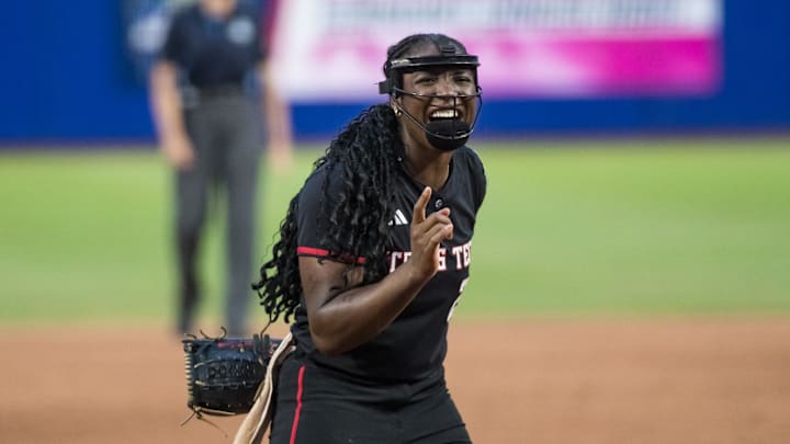Jun 4, 2025; Oklahoma City, OK, USA; Texas Tech Red Raiders pitcher NiJaree Canady (24) smiles and points to her catcher after a strikeout in the fifth inning against the Texas Longhorns during game one of the NCAA Softball Women's College World Series finals at Devon Park. Jun 4, 2025; Oklahoma City, OK, USA; Texas Tech Red Raiders pitcher NiJaree Canady (24) smiles and points to her catcher after a strikeout in the fifth inning against the Texas Longhorns during game one of the NCAA Softball Women's College World Series finals at Devon Park.