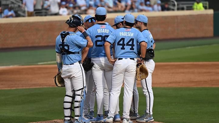 May 30, 2026; Chapel Hill, NC, USA; North Carolina Tar Heels pitcher Jason DeCaro (29) is met at the mound during game 4 of the Chapel Hill Regional at Boshamer Stadium. Mandatory Credit: William Howard-Imagn Images