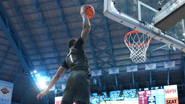 Feb 28, 2026; Chapel Hill, N.C.; Virginia Tech forward Tobi Lawal (1) scores in the first half.
