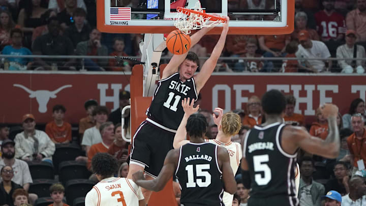 Jan 3, 2026; Austin, Texas, USA; Mississippi State Bulldogs forward Sergej Macura (11) dunks against Texas Longhorns center Matas Vokietaitis (8) during the first half at Moody Center. Mandatory Credit: Dustin Safranek-Imagn Images
