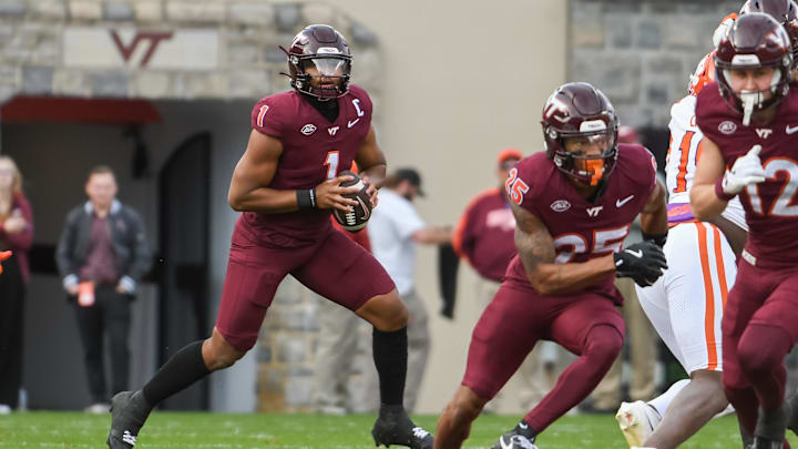 Nov 9, 2024; Blacksburg, Virginia, USA;  Virginia Tech Hokies quarterback Kyron Drones (1) looks to pass the ball against the Clemson Tigers during the second quarter at Lane Stadium. Mandatory Credit: Brian Bishop-Imagn Images