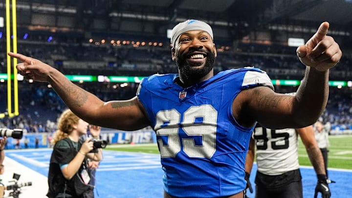 Detroit Lions defensive end Za'Darius Smith (99) waves at fans as he exits the field after 52-6 win over Jacksonville Jaguars during the second half at Ford Field in Detroit on Sunday, Nov. 17, 2024.