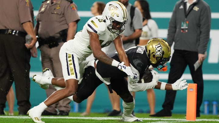 Dec 22, 2023; Tampa, FL, USA; UCF Knights wide receiver Javon Baker (1) catches a pass for a Dec 22, 2023; Tampa, FL, USA; UCF Knights wide receiver Javon Baker (1) catches a pass for a