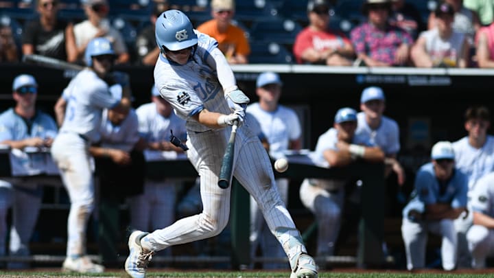Jun 14, 2024; Omaha, NE, USA; North Carolina Tar Heels center fielder Vance Honeycutt (7) drives in the winning run against the Virginia Cavaliers during the ninth inning at Charles Schwab Filed Omaha. Jun 14, 2024; Omaha, NE, USA; North Carolina Tar Heels center fielder Vance Honeycutt (7) drives in the winning run against the Virginia Cavaliers during the ninth inning at Charles Schwab Filed Omaha.