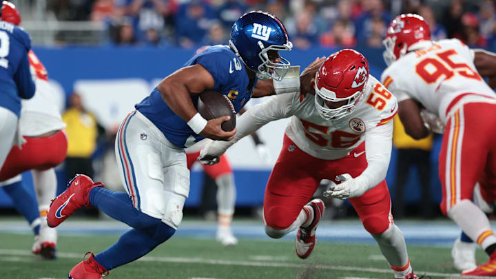 Sep 21, 2025; East Rutherford, New Jersey, USA; New York Giants quarterback Russell Wilson (3) runs against Kansas City Chiefs defensive end George Karlaftis (56) in the fourth quarter at MetLife Stadium.  
