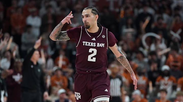Texas A&M Aggies guard Pop Isaacs reacts to a three-point basket against the Texas Longhorns during the second half at Moody Center.