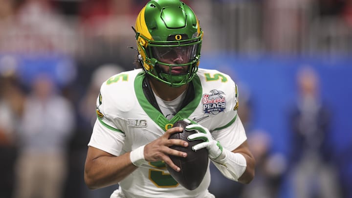 Jan 9, 2026; Atlanta, GA, USA; Oregon Ducks quarterback Dante Moore (5) looks to pass against the Indiana Hoosiers during the first half of the 2025 Peach Bowl and semifinal game of the College Football Playoff at Mercedes-Benz Stadium. Mandatory Credit: Brett Davis-Imagn Images