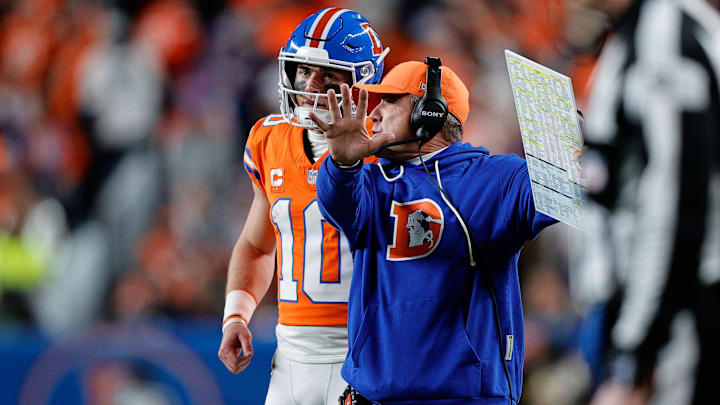 Nov 6, 2025; Denver, Colorado, USA; Denver Broncos quarterback Bo Nix (10) talks with head coach Sean Payton in the fourth quarter against the Las Vegas Raiders at Empower Field at Mile High. 