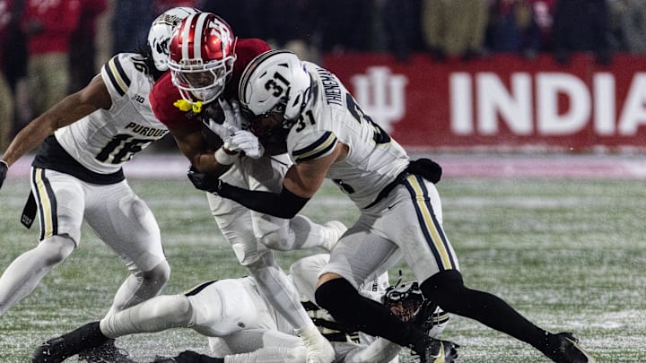 Nothing but the hits: Dillon Thieneman drives a shoulder into Indiana wide receiver Ke'Shawn Williams during a game in November. In two years patrolling the Boilermaker secondary, Thieneman accounted for 210 tackles and six interceptions. Mandatory Credit: Trevor Ruszkowski-Imagn Images