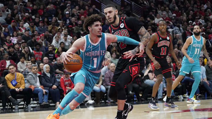 Jan 17, 2025; Chicago, Illinois, USA; Chicago Bulls guard Lonzo Ball (2) defends Charlotte Hornets guard LaMelo Ball (1) during the second half at United Center. Mandatory Credit: David Banks-Imagn Images