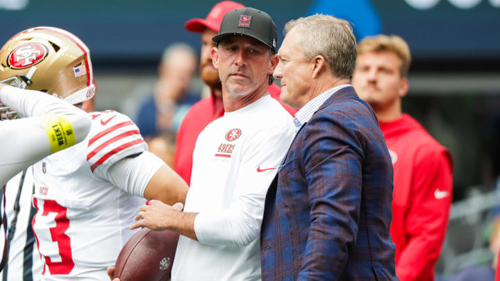 Sep 7, 2025; Seattle, Washington, USA; San Francisco 49ers general manager John Lynch, right, talks with head coach Kyle Shanahan during pregame warmups against the Seattle Seahawks at Lumen Field. Mandatory Credit: Joe Nicholson-Imagn Images