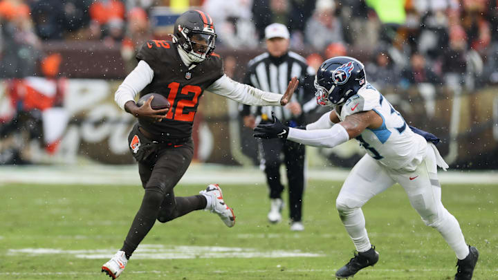 Dec 7, 2025; Cleveland, Ohio, USA; Cleveland Browns quarterback Shedeur Sanders (12) runs with the ball against Tennessee Titans linebacker Cedric Gray (33) during the second quarter at Huntington Bank Field. Mandatory Credit: Scott Galvin-Imagn Images Dec 7, 2025; Cleveland, Ohio, USA; Cleveland Browns quarterback Shedeur Sanders (12) runs with the ball against Tennessee Titans linebacker Cedric Gray (33) during the second quarter at Huntington Bank Field. Mandatory Credit: Scott Galvin-Imagn Images