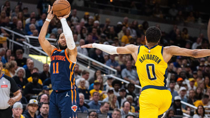 May 12, 2024; Indianapolis, Indiana, USA; New York Knicks guard Jalen Brunson (11) shoots the ball while Indiana Pacers guard Tyrese Haliburton (0) defends during game four of the second round for the 2024 NBA playoffs at Gainbridge Fieldhouse. Mandatory Credit: Trevor Ruszkowski-Imagn Images