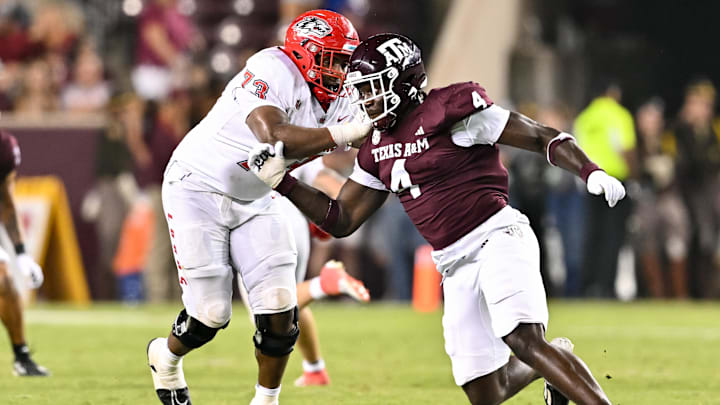 Texas A&M Aggies defensive lineman Shemar Stewart (4) breaks past New Mexico Lobos offensive lineman Matthew Toilolo (74) during the fourth quarter at Kyle Field.