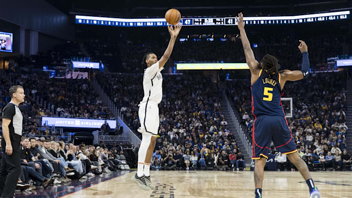 Nov 25, 2024; San Francisco, California, USA; Brooklyn Nets forward Ziaire Williams (1) takes a three-point shot over Golden State Warriors forward Kevon Looney (5) during the first half at Chase Center. Mandatory Credit: John Hefti-Imagn Images Nov 25, 2024; San Francisco, California, USA; Brooklyn Nets forward Ziaire Williams (1) takes a three-point shot over Golden State Warriors forward Kevon Looney (5) during the first half at Chase Center. Mandatory Credit: John Hefti-Imagn Images