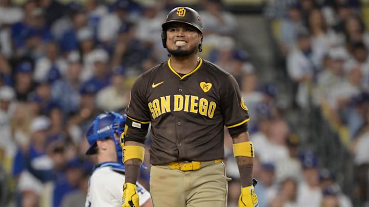 Oct 11, 2024; Los Angeles, California, USA; San Diego Padres first baseman Luis Arraez (4) reacts at bat in the sixth inning against the Los Angeles Dodgers during game five of the NLDS for the 2024 MLB Playoffs at Dodger Stadium. 