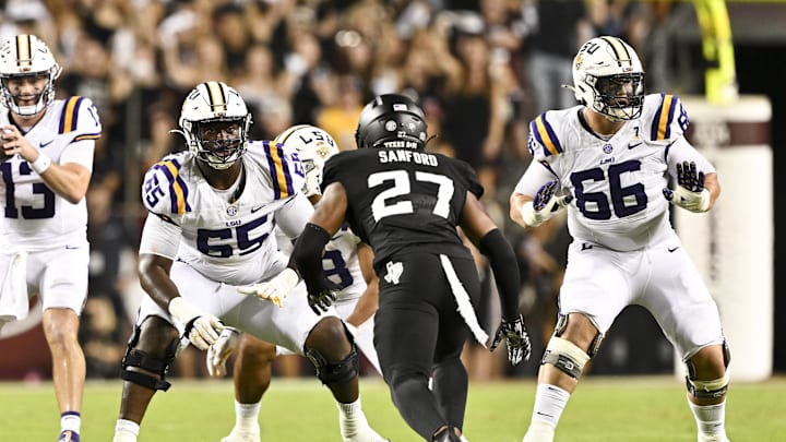 Oct 26, 2024; College Station, Texas, USA; LSU Tigers offensive lineman Paul Mubenga (65) lines up during the second half against the Texas A&M Aggies. The Aggies defeated the Tigers 38-23; at Kyle Field. Mandatory Credit: Maria Lysaker-Imagn Images.  