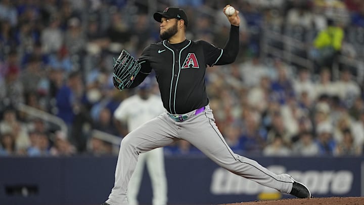Jun 18, 2025; Toronto, Ontario, CAN; Arizona Diamondbacks starting pitcher Eduardo Rodriguez (57) pitches to the Toronto Blue Jays during the first inning at Rogers Centre. Mandatory Credit: John E. Sokolowski-Imagn Images