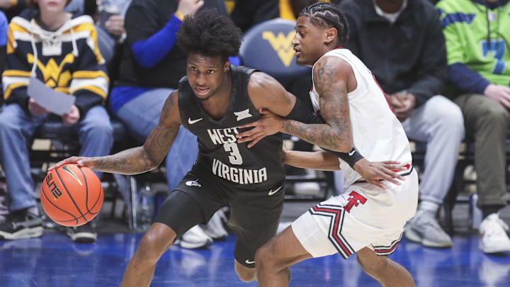 Feb 8, 2026; Morgantown, West Virginia, USA; West Virginia Mountaineers guard Honor Huff (3) dribbles against Texas Tech Red Raiders guard Jaylen Petty (11) during the first half at Hope Coliseum. Mandatory Credit: Ben Queen-Imagn Images