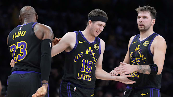 Nov 18, 2025; Los Angeles, California, USA; Los Angeles Lakers guard Austin Reaves (15) is congratulated by forward LeBron James (23) and guard Luka Doncic (77) after a three-point basket in the second quarter at Crypto.com Arena. Mandatory Credit: Kirby Lee-Imagn Images Nov 18, 2025; Los Angeles, California, USA; Los Angeles Lakers guard Austin Reaves (15) is congratulated by forward LeBron James (23) and guard Luka Doncic (77) after a three-point basket in the second quarter at Crypto.com Arena. Mandatory Credit: Kirby Lee-Imagn Images
