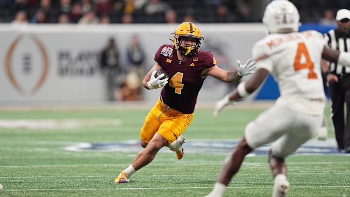 Jan 1, 2025; Atlanta, GA, USA; Arizona State Sun Devils running back Cam Skattebo (4) runs with the ball against the Texas Longhorns during the second half of the Peach Bowl at Mercedes-Benz Stadium. Mandatory Credit: Dale Zanine-Imagn Images