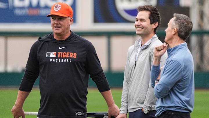 Detroit Tigers manager A.J. Hinch, left, talks to president of baseball operation Scott Harris, center, and team owner Chris Ilitch during spring training at Joker Marchant Stadium in Lakeland, Fla. on Thursday, Feb. 20, 2025.