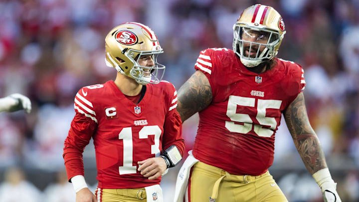 Dec 17, 2023; Glendale, Arizona, USA; San Francisco 49ers quarterback Brock Purdy (13) celebrates a touchdown with guard Jon Feliciano (55) against the Arizona Cardinals at State Farm Stadium. Mandatory Credit: Mark J. Rebilas-Imagn Images