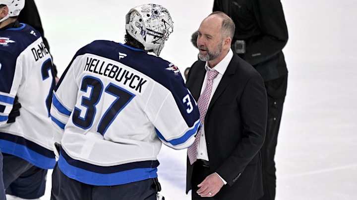 May 17, 2025; Dallas, Texas, USA; Winnipeg Jets goaltender Connor Hellebuyck (37) shakes hands with Dallas Stars head coach Pete DeBoer after the Stars defeat the Jets in the overtime period in game six of the second round of the 2025 Stanley Cup Playoffs at American Airlines Center. Mandatory Credit: Jerome Miron-Imagn Images