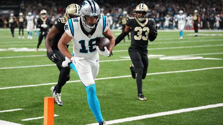 Dec 14, 2025; New Orleans, Louisiana, USA; Carolina Panthers wide receiver Jalen Coker (18) scores a touchdown in the third quarter against the New Orleans Saints at Caesars Superdome. Mandatory Credit: Matthew Hinton-Imagn Images