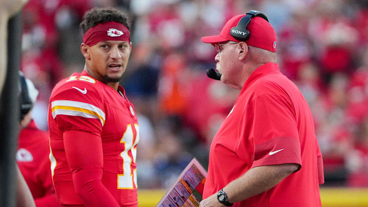 Aug 22, 2025; Kansas City, Missouri, USA; Kansas City Chiefs quarterback Patrick Mahomes (15) talks with head coach Andy Reid after a play against the Chicago Bears during the first half of the game at GEHA Field at Arrowhead Stadium. Mandatory Credit: Denny Medley-Imagn Images