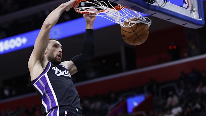 Apr 7, 2025; Detroit, Michigan, USA;  Sacramento Kings guard Zach LaVine (8) dunks in the first half against the Detroit Pistons at Little Caesars Arena. Mandatory Credit: Rick Osentoski-Imagn Images