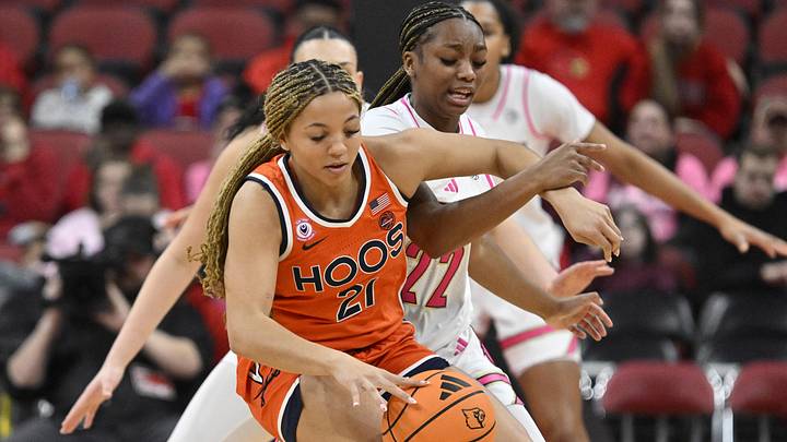Feb 22, 2026; Louisville, Kentucky, USA; Virginia Cavaliers guard Kymora Johnson (21) dribbles under the pressure of Louisville Cardinals guard Tajianna Roberts (22) during the first half at KFC Yum! Center. Mandatory Credit: Jamie Rhodes-Imagn Images Feb 22, 2026; Louisville, Kentucky, USA; Virginia Cavaliers guard Kymora Johnson (21) dribbles under the pressure of Louisville Cardinals guard Tajianna Roberts (22) during the first half at KFC Yum! Center. Mandatory Credit: Jamie Rhodes-Imagn Images