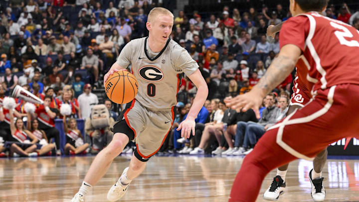 Mar 12, 2025; Nashville, TN, USA;  Georgia Bulldogs guard Blue Cain (0) dribbles the ball against the Oklahoma Sooners during the first half at Bridgestone Arena. Mandatory Credit: Steve Roberts-Imagn Images