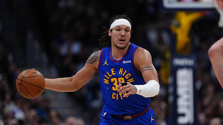 Mar 22, 2026; Denver, Colorado, USA; Denver Nuggets forward Aaron Gordon (32) controls the ball in the first quarter at Ball Arena.
