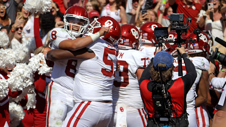 Oklahoma Sooners quarterback Dillon Gabriel (8) celebrates with Oklahoma Sooners offensive lineman