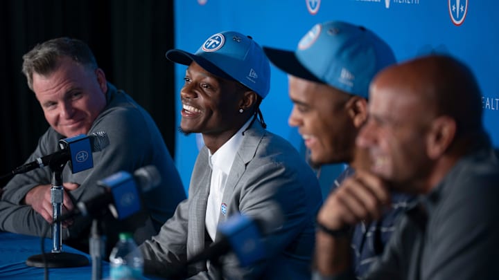 Tennessee Titans first round draft pick Carnell Tate, second left, fields questions from the media at Vanderbilt Health Football Center Friday, April 24, 2026. Also pictured are, from left, Mike Borgonzi, general manager, fellow first-rounder Keldric Faulk and Coach Robert Saleh.