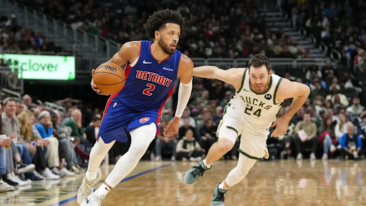 Nov 13, 2024; Milwaukee, Wisconsin, USA;  Detroit Pistons guard Cade Cunningham (2) drives for the basket in front of Milwaukee Bucks guard Pat Connaughton (24) during the third quarter at Fiserv Forum. Mandatory Credit: Jeff Hanisch-Imagn Images