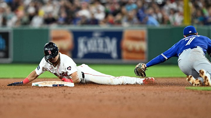 Aug 27, 2024; Boston, Massachusetts, USA; Boston Red Sox shortstop David Hamilton (70) steals second base against Toronto Blue Jays third baseman Will Wagner (7) during the fifth inning at Fenway Park. Mandatory Credit: Brian Fluharty-Imagn Images
