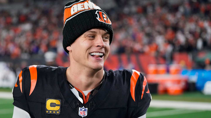 Bengals quarterback Joe Burrow celebrates a Week 17 overtime win over the Denver Broncos that kept Cincinnati's slim playoff hopes alive. Burrow threw for 412 yards and three touchdowns in the game and also added a rushing score.