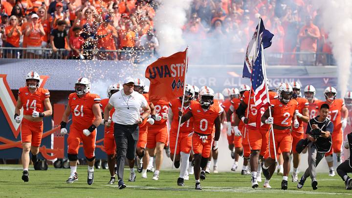 Aug 29, 2026; Charlottesville, Virginia, USA; Virginia Cavaliers enter the field before the game against the North Carolina State Wolfpack at Scott Stadium. Mandatory Credit: Greg Atkins-Imagn Images Aug 29, 2026; Charlottesville, Virginia, USA; Virginia Cavaliers enter the field before the game against the North Carolina State Wolfpack at Scott Stadium. Mandatory Credit: Greg Atkins-Imagn Images