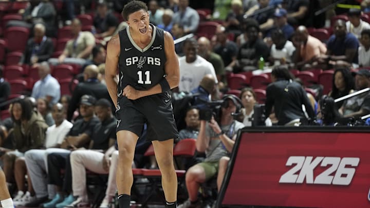 Jul 10, 2025; Las Vegas, NV, USA; San Antonio Spurs forward Carter Bryant (11) reacts to a play against the Philadelphia 76ers in the first quarter of their game at Thomas & Mack Center. Mandatory Credit: Candice Ward-Imagn Images
