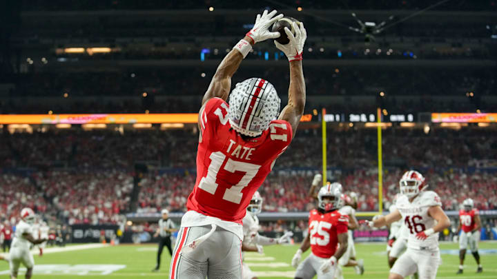 Ohio State Buckeyes wide receiver Carnell Tate (17) makes a catch for a touchdown Saturday, Dec. 6, 2025, during the Big Ten football championship against the Indiana Hoosiers at Lucas Oil Stadium in Indianapolis.