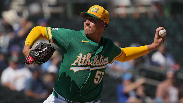 Mar 8, 2026; Mesa, Arizona, USA; Athletics pitcher Jacob Lopez (57) throws against the Los Angeles Dodgers in the first inning at Hohokam Stadium. Mandatory Credit: Rick Scuteri-Imagn Images